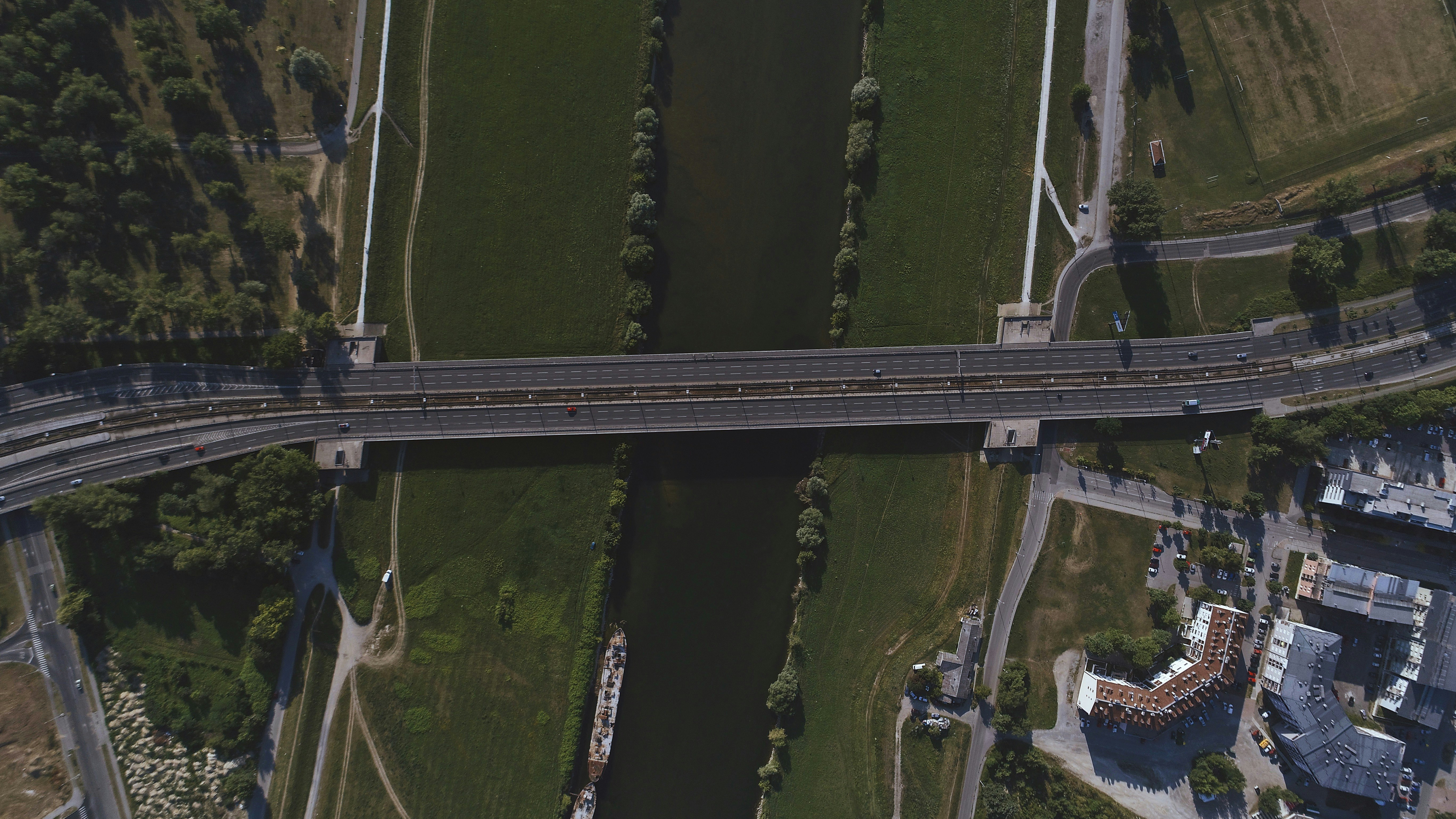 bird's eye view of bridge crossing body of water